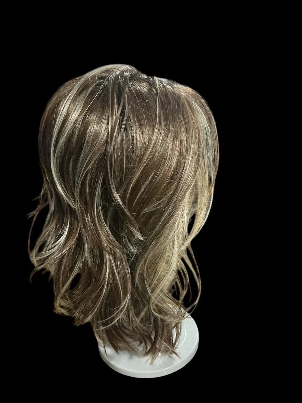 Rene of Paris Natural Layered Women's Wig in Light Brown with Blonde Highlights.